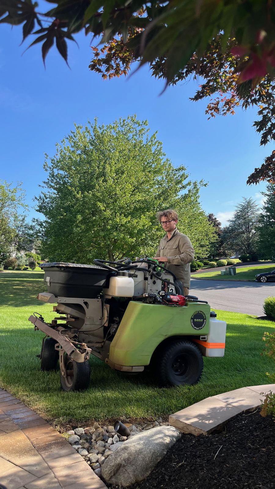Our Steel Green spreader-sprayer fertilizing a lawn